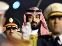 Saudi Crown Prince Mohammed bin Salman is seen behind a military band upon his arrival at Algiers International Airport, southeast of the capital Algiers on December 2, 2018 Saudi Crown Prince Mohammed bin Salman is seen behind a military band upon his arrival at Algiers International Airport, southeast of the capital Algiers on December 2, 2018