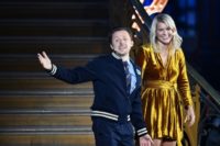 Norwegian forward Ada Hegerberg (R) stands alongside French DJ and producer Martin Solveig (L) after receiving the 2018 women's Ballon d'Or award.