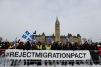 Right-wing protesters rally against the UN international pact on migration at Parliament Hill in Ottawa