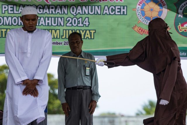 Indonesia's Aceh lashes men 100 times each for sex crimes