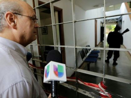 Nicaragua police raid opposition paper, end rights groups' permits