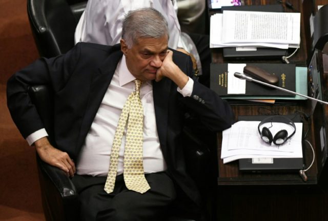 Sri Lanka reinstates ousted PM, ending power struggle