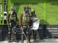 Indian police fired tear gas to drive back dozens of Kashmiri protesters led by a key separatist leader who tried to reach an Indian military base Kashmir locked down as Indian forces warn against protests