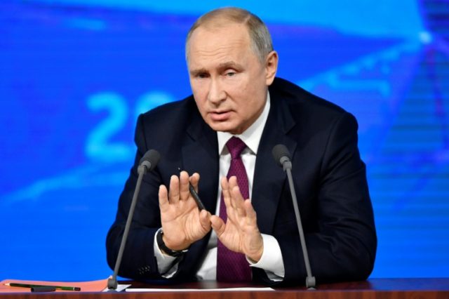 Putin pushes economic growth at annual press conference
