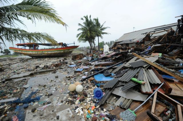 Indonesia rescuers scramble to reach isolated tsunami-struck towns