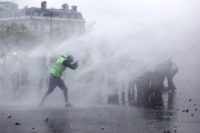 French police, protesters clash in Paris riot; 65 injured