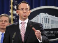US China Espionage Deputy Attorney General Rod Rosenstein with FBI Director Christopher Wray, speaks during a news conference at the Department of Justice in Washington, Thursday, Dec. 20, 2018. The Justice Department is charging two Chinese citizens with carrying out an extensive hacking campaign to steal data from U.S. companies. An indictment was unsealed Thursday against Zhu Hua and Zhang Shillong. Court papers filed in Manhattan federal court allege the hackers were able to breach the computers of more than 45 entities in 12 states. (AP Photo/Manuel Balce Ceneta) The Associated Press