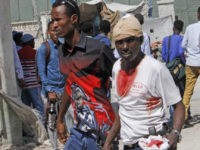 Somalia Deadly Blast An injured man is helped following a bomb blast near the presidential palace in the capital Mogadishu, Somalia, Saturday, Dec. 22, 2018. Police say a suicide car bomb detonated near the presidential palace has killed at least 6 people and wounded several others. (AP Photo/Farah Abdi Warsameh) The Associated Press