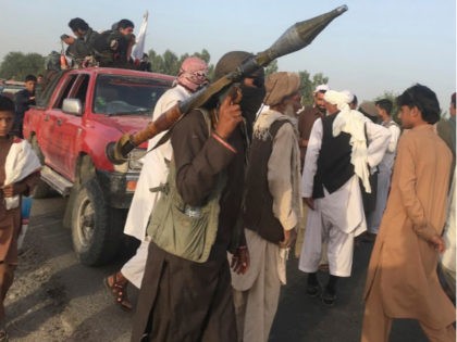 Taliban fighters gather in Surkhroad district of Nangarhar province, east of Kabul, Afghanistan, Saturday, June 16, 2018. A suicide bomber blew himself up in eastern Afghanistan on Saturday as mostly Taliban fighters gathered to celebrate a three-day cease fire marking the Islamic holiday of Eid al-Fitr, killing 21 people and …