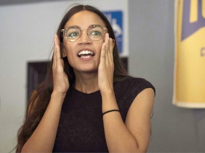 Democratic congressional candidate Alexandria Ocasio-Cortez talks with supporters during her general campaign kick-off rally on September 22, 2018 in the Bronx borough of New York. (Photo by Don EMMERT / AFP) (Photo credit should read DON EMMERT/AFP/Getty Images)