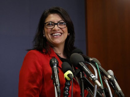 Rep.-elect Rashida Tlaib, D-Mich., pauses to speak to media as she walks from member-elect