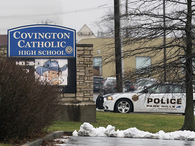 A police car sits at the entrance to Covington Catholic High School in Park Hills, Ky., Saturday, Jan 19, 2019. A diocese in Kentucky apologized Saturday after videos emerged showing students from the Catholic boys' high school mocking Native Americans outside the Lincoln Memorial on Friday after a rally in …