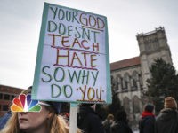 Native American March Videos (INSET: NBC News logo) Protestors gather outside the Catholic Diocese of Covington Tuesday, Jan. 22, 2019, in Covington, Ky. The diocese in Kentucky has apologized after videos emerged showing students from Covington Catholic High School mocking Native Americans outside the Lincoln Memorial on Friday after a rally in Washington. (AP …