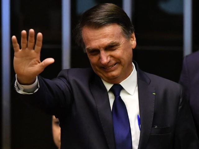 Brazil's President-elect Jair Bolsonaro gestures at the Congress before he is sworn in as Brazil's new president, in Brasilia on January 1, 2019. - Bolsonaro takes office with promises to radically change the path taken by Latin America's biggest country by trashing decades of centre-left policies.