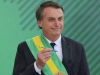 Brazil-President-Jair-Bolsonaro-swearing-in-pen-Getty Brazil's new President Jair Bolsonaro poses with the pen used during the swearing-in ceremony for the minsters at the Planalto Palace in Brasilia on January 1, 2019, after his own inauguration at the national Congress. - Bolsonaro takes office with promises to radically change the path taken by Latin America's …