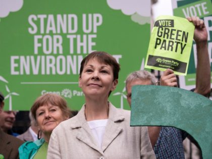 Green Party co-leader Caroline Lucas poses for a photograph with a green question mark outside the entrance to Downing Street in central London on May 30, 2017, during a general election campaign event to highlight the lack of debate by other political parties on environmental issues, as campaigning continues in …