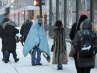 A homeless man bundles up in downtown Chicago. (AP Photo/Kiichiro Sato)