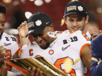 Clemson Tigers ANUARY 07: Adam Choice #26 of the Clemson Tigers celebrates his teams 44-16 win over the Alabama Crimson Tide with the trophy in the CFP National Championship presented by AT&T at Levi's Stadium on January 7, 2019 in Santa Clara, California. (Photo by Christian Petersen/Getty Images)