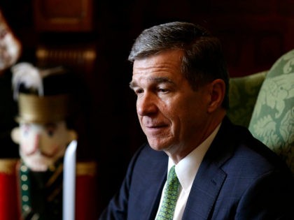 In this photo taken Wednesday, Dec. 19, 2018 North Carolina Gov. Roy Cooper pauses during an interview at the Governor's mansion in Raleigh, N.C. Cooper hasn’t given up yet on Apple creating more jobs soon in North Carolina. Cooper declined to comment Wednesday on why the state didn’t land thousands …