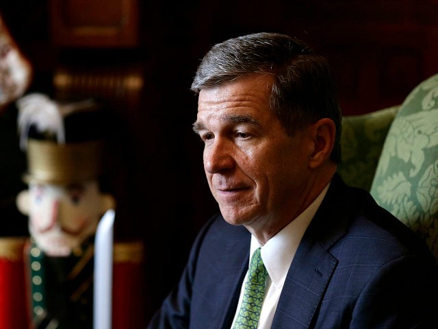 In this photo taken Wednesday, Dec. 19, 2018 North Carolina Gov. Roy Cooper pauses during