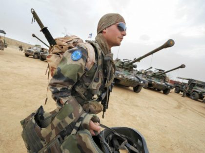 A French soldier of the European Union peacekeepers carries his gears as he walks into Farchana camp, East of Chad after returning from patrol on June. 27, 2008 where EUFOR contingent have deployed to secure refugees camps and protect local population from attacks by different local militiamen. The mainly French …