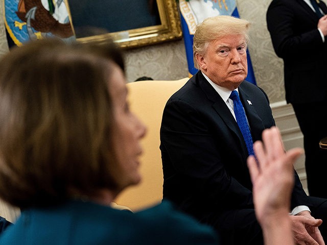 US President Donald Trump (R) listens while presumptive Speaker, House Minority Leader Nan