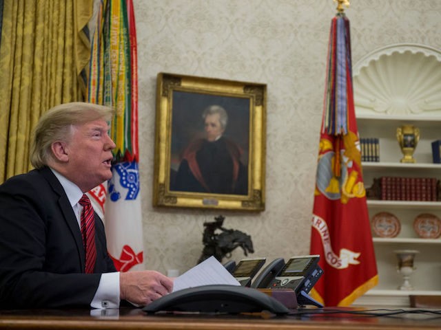 U.S. President Donald Trump makes a video call to service members from the Army, Marine Corps, Navy, Air Force, and Coast Guard stationed worldwide in the Oval Office at the White House December 25, 2018 in Washington, DC. (Photo by Zach Gibson-Pool/Getty Images)