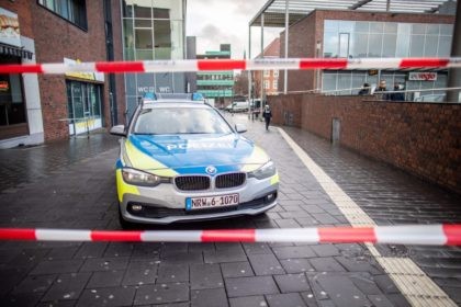 A picture taken on January 1, 2019 in Bottrop shows a police car in a cordoned off area at