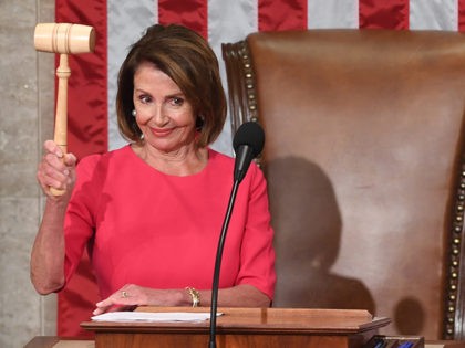 Incoming House Speaker Nancy Pelosi, D-CA, holds the gavel during the opening session of t