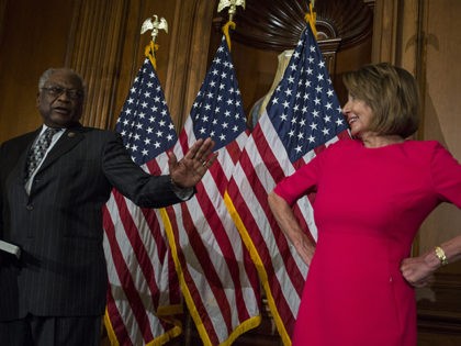 WASHINGTON, DC - JANUARY 03: House Majority Whip Jim Clyburn (D-SC) speaks to House Speaker Nancy Pelosi (D-CA) during a ceremonial mock swearing in ceremony on Capitol Hill on January 3, 2019 in Washington, DC. Under the cloud of a partial federal government shutdown, Pelosi reclaimed her former title as …