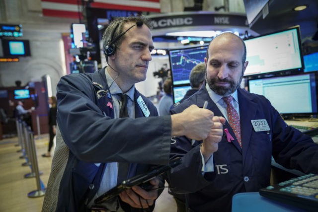 NEW YORK, NY - JANUARY 4: Traders and financial professionals work on the floor of the New