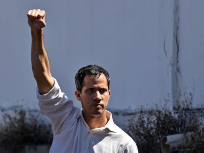 Venezuela's National Assembly president Juan Guaido gestures before a crowd of opposition supporters during an open meeting in Caraballeda, Vargas State, Venezuela, on January 13, 2019. - The president of the opposition-controlled but sidelined National Assembly was released less than an hour after being arrested by Venezuelan intelligence agents on …
