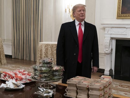 WASHINGTON, DC - JANUARY 14: U.S. President Donald Trump presents fast food to be served t