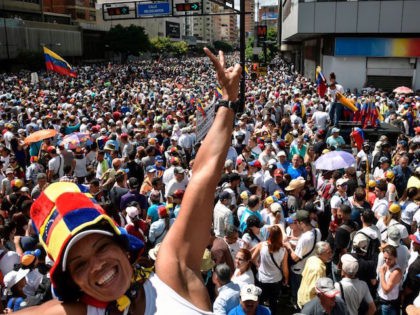 Venezuelan opposition supporters take to the streets to protest against the government of