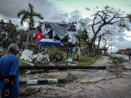 A resident of tornado-hit Regla neighbourhood looks at destroyed buildings, in Havana, on