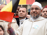 Members of the Muslim Community of Belgium, including Molenbeek Imam, Cheik Mohamed Toujgani (R), take part in a tribute, called by Muslim organizations, to the victims of the March 22 Brussels terror attacks on April 9, 2016, outside of Maelbeek / Maalbeek metro station, Brussels. On March 22, two bombs …