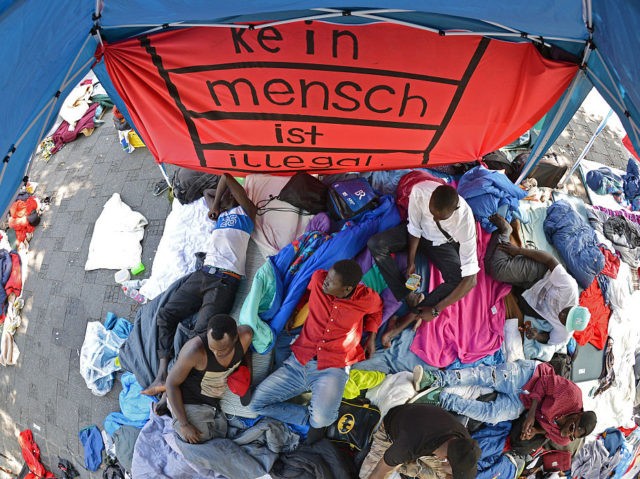 MUNICH, GERMANY - SEPTEMBER 13: Migrants and refugees protesting against deportation and for better conditions camp out next to Sendlinger Tor city gate on September 13, 2016 in Munich, Germany. Approximately 50 men from countries including Pakistan and Congo are threatening to launch a hunger strike if their demand to …