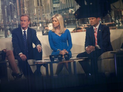 NEW YORK, NY - FEBRUARY 17: Seen through a window, (L to R) hosts Steve Doocy, Ainsley Earhardt, and Brian Kilmeade broadcast 'Fox And Friends' from the Fox News studios, February 17, 2017 in New York City. President Trump, a frequent consumer and critic of cable news, recently tweeted that …