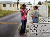 Census Outreach Program Encourages People To Return Census Form MIAMI - APRIL 10: U.S. Census worker, Monique Stence, (L) gives the thumbs up to Nilda Borroto who had already returned her census form as they blanket a neighborhood during the "March to the Mailbox" effort on April 10, 2010 in Miami, Florida. The U.S. Census is using the "March …