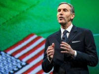 Starbucks Chairman and CEO Howard Schultz talks about the company's goal to hire 10,000 military veteran's and military spouses during the Starbucks annual shareholders meeting March 18, 2015 in Seattle, Washington. Schultz also announced a 2-for-1 stock split, the sixth in the company's history, during the meeting. (Stephen Brashear/Getty Images)