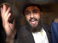 Jamal-al-Badawi-hand-up-getty Jamal al-Badawi, a suspect of the USS Cole destroyer's bombing in 2000 in the Yemeni port of Aden, gestures after an appeal court announced his judgementto 15 years in prison in the final appeal session trial, 26 February 2005. The court upheld today one death sentence against an Al-Qaeda militant …