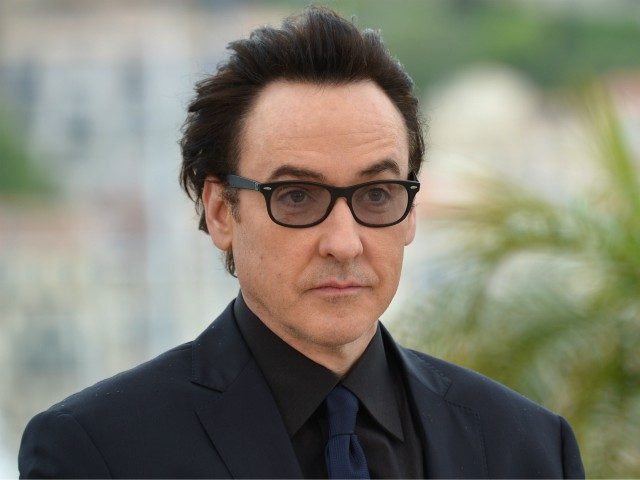 US actor John Cusack poses during a photocall for the film 'Maps to the Stars' a