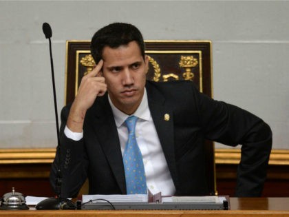 The president of Venezuela's opposition-led National Assembly, Juan Guaido, listens during