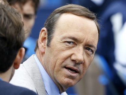 American actor Kevin Spacey watches Nicolas Mahut of France and Andy Murray of Britain play a tennis match at the Queen's Club grass court championships in London, Wednesday, June 12, 2013. (AP Photo/Kirsty Wigglesworth)