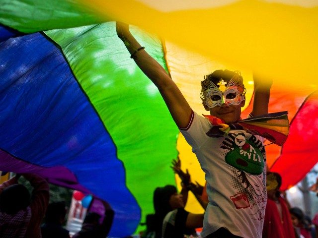 NEW DELHI, INDIA - NOVEMBER 27: A boy dances as he and others participate during the 4th Delhi Queer Pride 2011 March on November 27, 2011 in New Delhi, India. India's Lesbian, Gay, Bisexual and Transgender (LGBT) community celebrated the 4th Delhi Queer Pride March with a parade through the …