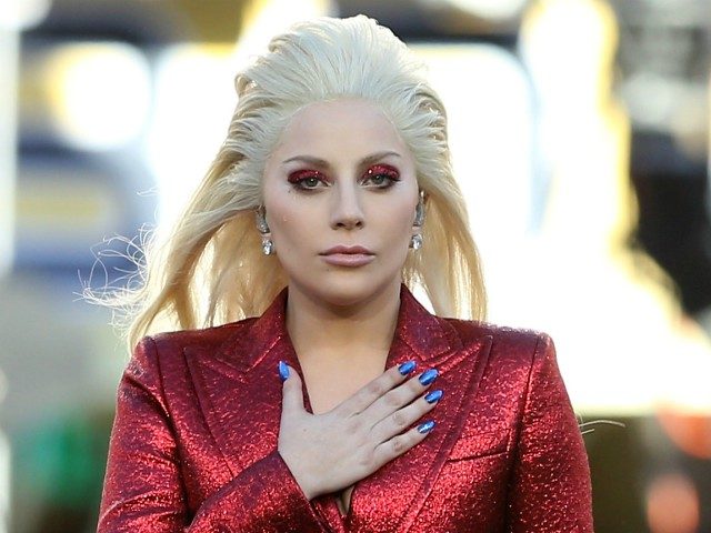 SANTA CLARA, CA - FEBRUARY 07: Recording artist Lady Gaga performs the national anthem prior to Super Bowl 50 between the Denver Broncos and the Carolina Panthers at Levi's Stadium on February 7, 2016 in Santa Clara, California. (Photo by Streeter Lecka/Getty Images)