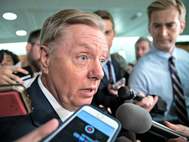 Sen. Lindsey Graham, R-S.C., a member of the Senate Judiciary Committee, responds to reporters after Sen. Jeff Flake, R-Ariz., a member of the committee, called for the FBI to investigate the sexual misconduct claims against Supreme Court nominee Brett Kavanaugh, on Capitol Hill in Washington, Friday, Sept. 28, 2018. Graham …