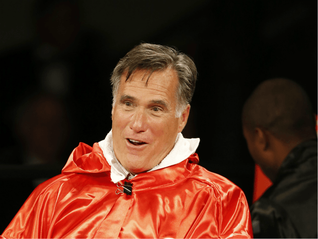 Mitt Romney taunts Evander Holyfield before a charity boxing event on May 15, 2015 in Salt Lake City, Utah. The event was held to raise money for 'Charity Vision' a charity that aims to restore sight to the blind and visually impaired. (Photo by George Frey/Getty Images)