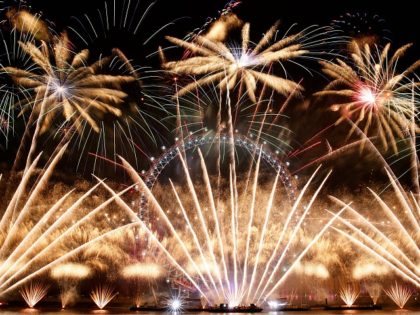 Fireworks explode around the London Eye during New Year's celebrations in central London j