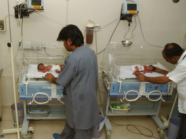 In this file photo taken Wednesday, Oct. 4, 2006, Pakistani hospital staff members attend